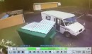U.S. Postal worker throws mail in the trash