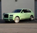 Rolls-Royce Cullinan Black Badge riding on Forgiatos has matching badges and mint green wrapped umbrella