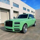 Rolls-Royce Cullinan Black Badge riding on Forgiatos has matching badges and mint green wrapped umbrella