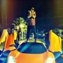 French Montana sitting on the hood of a McLaren 12C