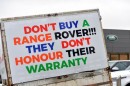 Range Rover parked Outside Dealership in Cardiff with Angry Signs