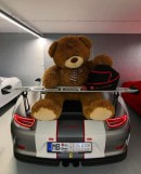 Giant teddy bear sitting on Porsche 911 GT3 RS