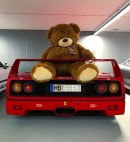 Giant teddy bear sitting on Ferrari F40