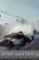 Pickup with trailer on fire shown speeding on Thai town street