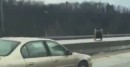 Spool of wire set loose on highway