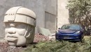 Giant stone head sculpture crushes Tesla Model 3