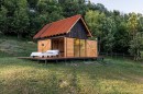 The GlamBOX is a non-wheeled tiny house for glamping, with a master bed that can be rolled outside