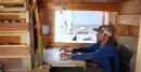 Man builds micro cabin on wheels for only $4K
