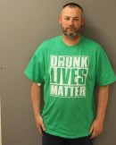 Mug shot of man caught driving under the influence wearing a "Drunk Lives Matter" shirt