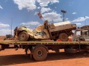 Mechanic parks too close to loaded mining truck, runs over his own pickup
