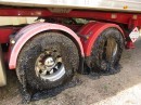 Road in Australia melts in the heatwave, covering wheels in bitumen and gravel