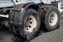 Road in Australia melts in the heatwave, covering wheels in bitumen and gravel