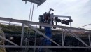 Prototype of a gigantic robot worker fixes railway wires in Japan
