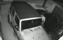 Thieves stealing a Jeep Wrangler