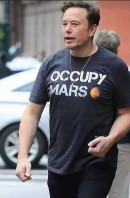 Elon Musk wearing a T-shirt that reads "Occupy Mars"