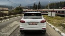 2015 Porsche Cayenne Turbo waiting for the train