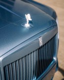 Rolls-Royce Cullinan Ice Blue wrap riding on 26 inch aftermarket wheels