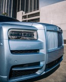 Rolls-Royce Cullinan Ice Blue wrap riding on 26 inch aftermarket wheels