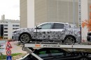 F40 BMW 1 Series Hatchback Spied With Less Camo on a Carrier