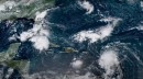 NOAA satellites monitoring storms in the Atlantic and Pacific Oceans
