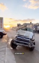 Toyota Land Cruiser pickup truck looks like it's been in a crusher