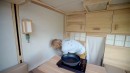 Inconspicuous Box Truck Camper Hides a Game-Changing Layout With a Unique Levitating Desk