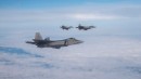 F-22 Raptors flyign formation