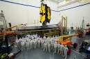 Technicians and engineers pose in front of NASAs JWST