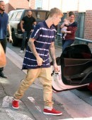 Justin Bieber Sucks on a Lollipop While Driving His Bright Red Ferrari
