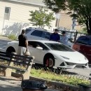 Lamborghini Huracan without wheels sitting on milk crates in the Bronx
