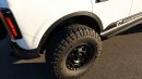 Lifted 2021 Ford Bronco on 37s drag races Ford Focus, GMC truck and V8 Silverado on Town and Country TV