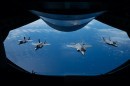 Formation of four F-35 Lightning IIs over the Pacific
