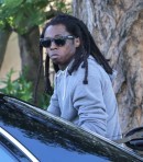Lil Wayne Rides in Style on the Back Seat of His Maybach Landaulet