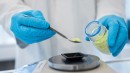 Theion scientist prepares sulphur powder for the next test build-up of cells