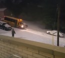 School bus has a cocktail of snow and gravity