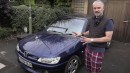 Cat videobombing reviewer trying to sell his cars