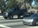 Ford F-150 truck parked on Toyota Camry