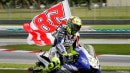Rossi and his #58 flag at Sepang