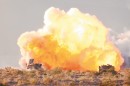 A Mine Clearing Line Charge explodes as 1st Tank Battalion tanks prepare to assault through their objective during a portion of the combined arms exercise