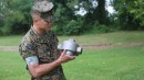 Justin Trejo, a project officer with the Program Manager for Ammunition at Marine Corps Systems Command, displays a 3D-printed headcap