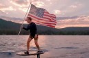 Mark Zuckerberg flies the American flag on the 4th of July while wakesurfing on his e-board on Lake Tahoe