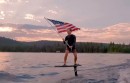 Mark Zuckerberg flies the American flag on the 4th of July while wakesurfing on his e-board on Lake Tahoe