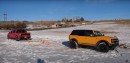 Five-way truck tug-of-war contest in the snow