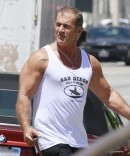 Mel Gibson Flexes his Muscles Next to his BMW
