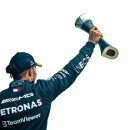 Lewis Hamilton lifting his third place trophy at the 2023 British GP