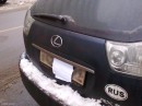 Number plate masked with paper