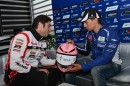 Lorenzo signs the helmet for Oscar Haro