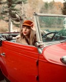 Taylor Swift glams it up in a vintage Chevy Cabriolet for the artwork for RED, her 2021 album