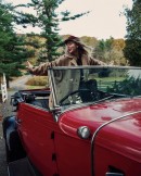 Taylor Swift glams it up in a vintage Chevy Cabriolet for the artwork for RED, her 2021 album