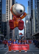 Astronaut Snoopy floating over New York
